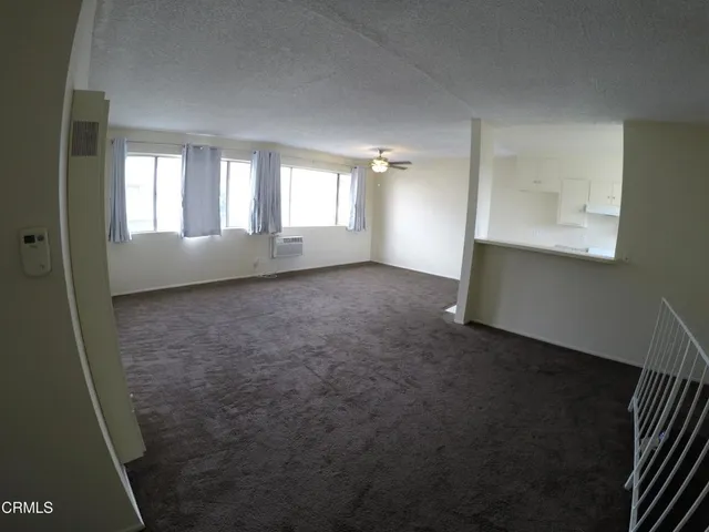 a kitchen with stainless steel appliances a sink stove and cabinets