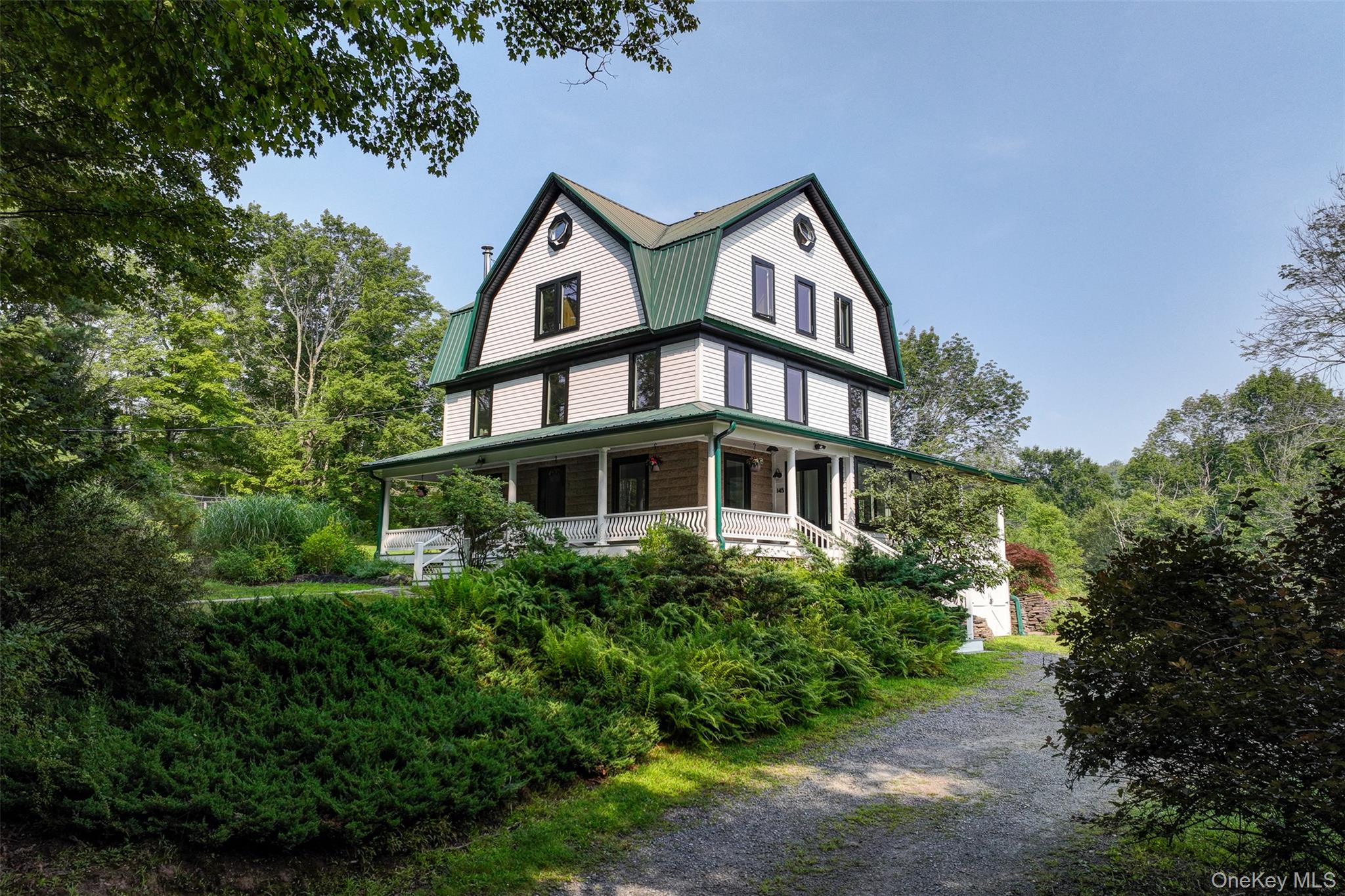 145 Likel Road Jeffersonville, NY 12748 - Photo 1 of 1 a view of a big house with plants and large trees