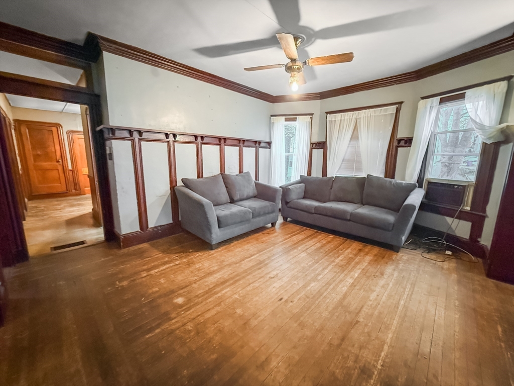 265 Ames Street Lawrence, MA 01841 - Photo 2 of 18 a living room with furniture and a large window