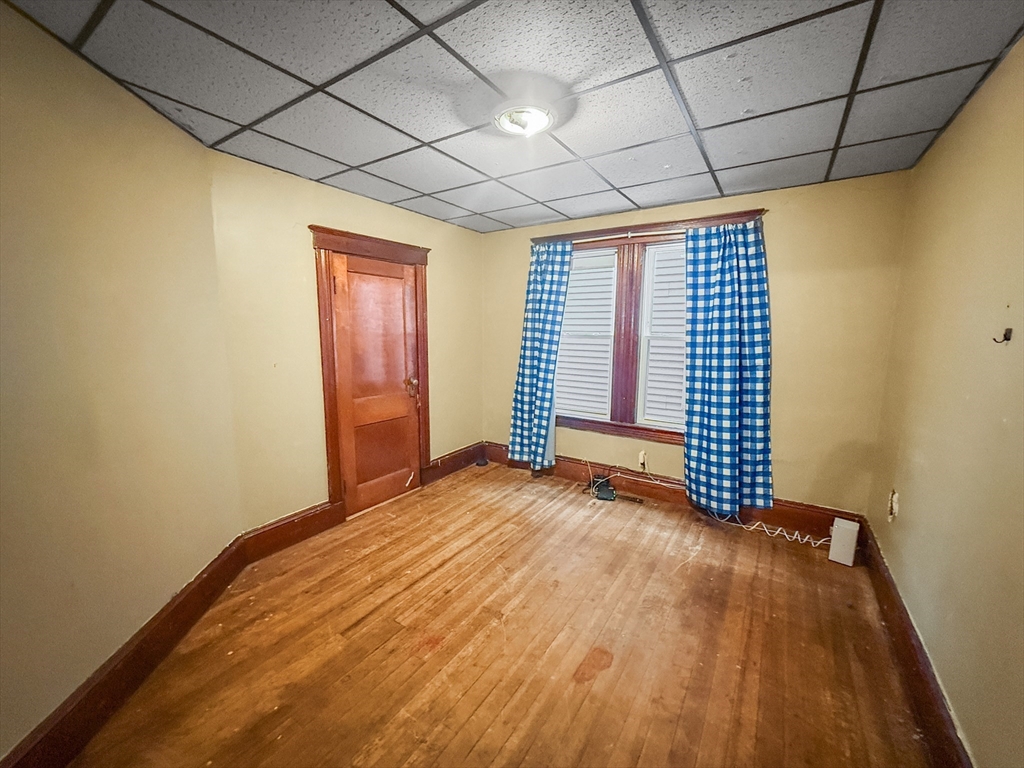 265 Ames Street Lawrence, MA 01841 - Photo 5 of 18 a view of empty room with wooden floor