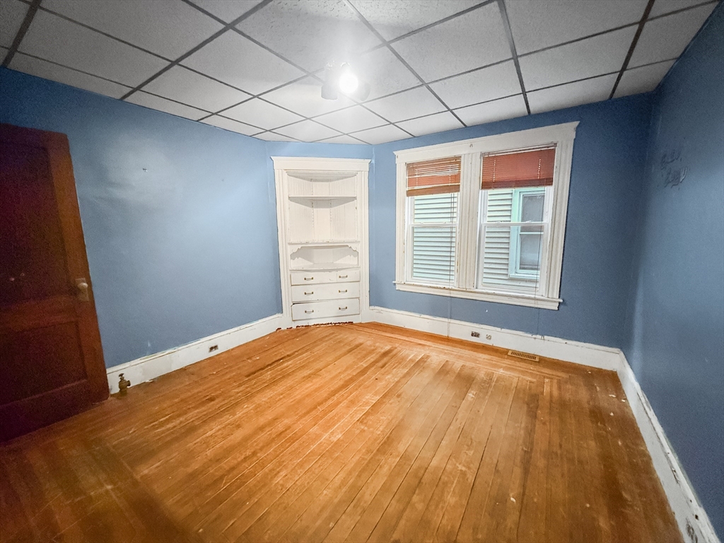 265 Ames Street Lawrence, MA 01841 - Photo 6 of 18 a view of an empty room with a window