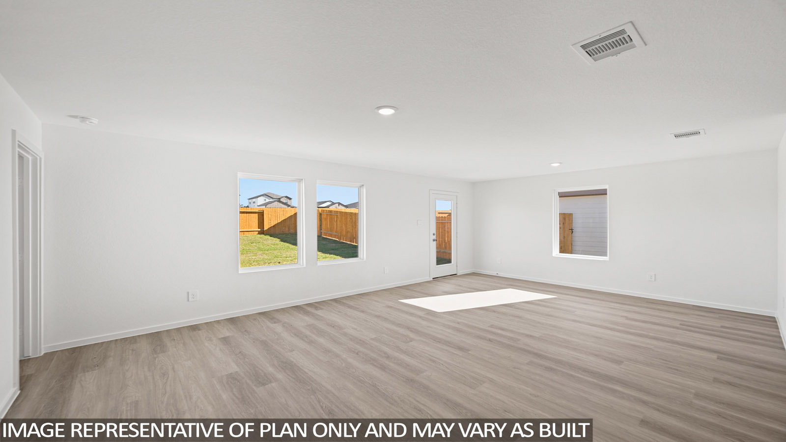 177 Baby Calf Roping Road Jarrell, TX 76537 - Photo 6 of 23 a view of an empty room with window and wooden floor