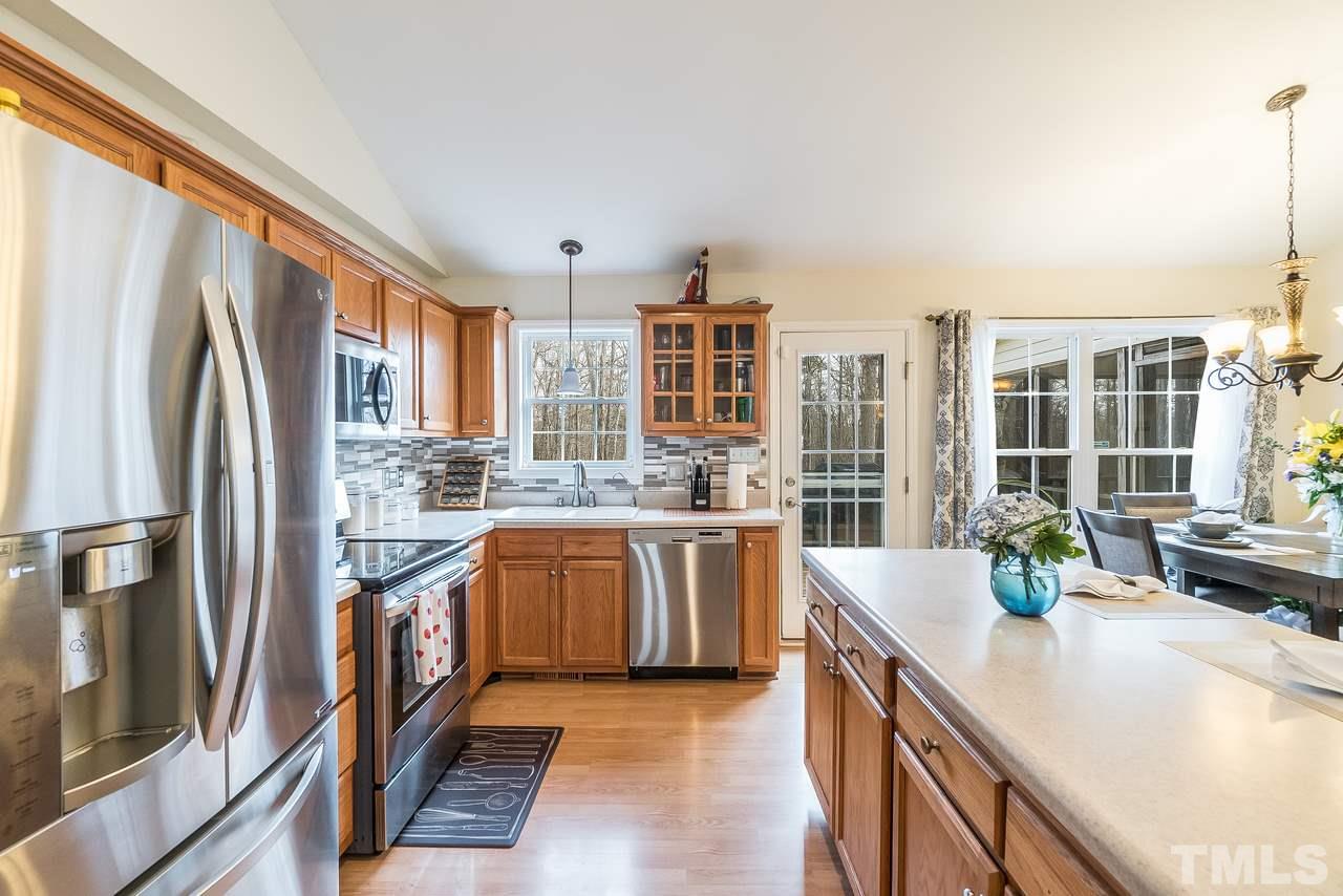 5712 Novaglen Road Durham, NC 27712 - Photo 11 of 27 Light, bright kitchen and dining areas connect to back deck and yard!