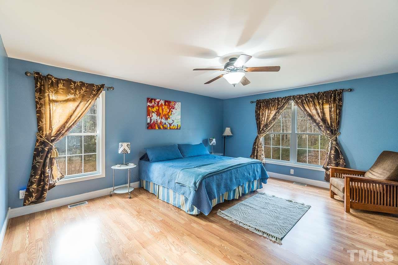 5712 Novaglen Road Durham, NC 27712 - Photo 12 of 27 Peaceful, spacious master retreat is away from the home office, so you can disconnect & relax after the workday!