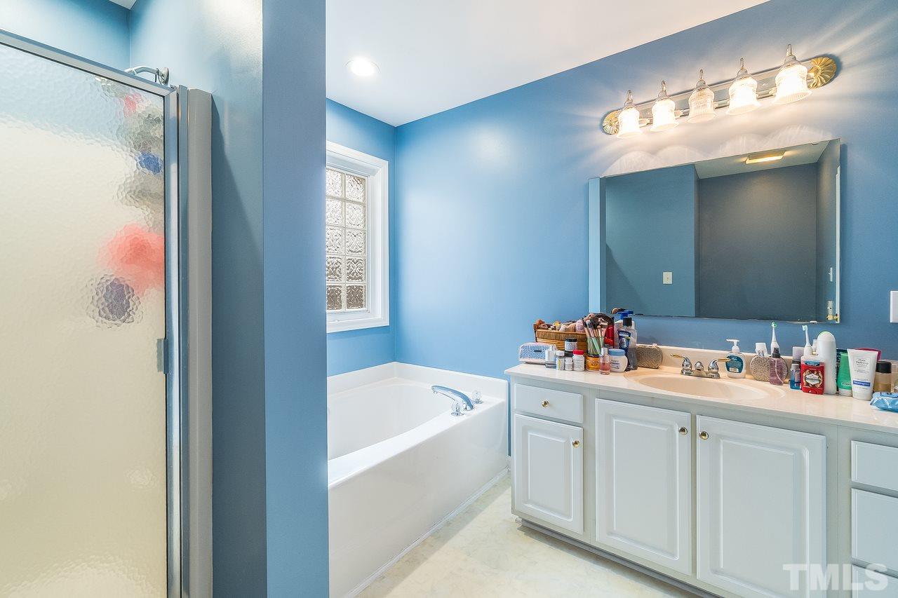 5712 Novaglen Road Durham, NC 27712 - Photo 14 of 27 Master bath has dual vanities, separate shower, and soaking tub!