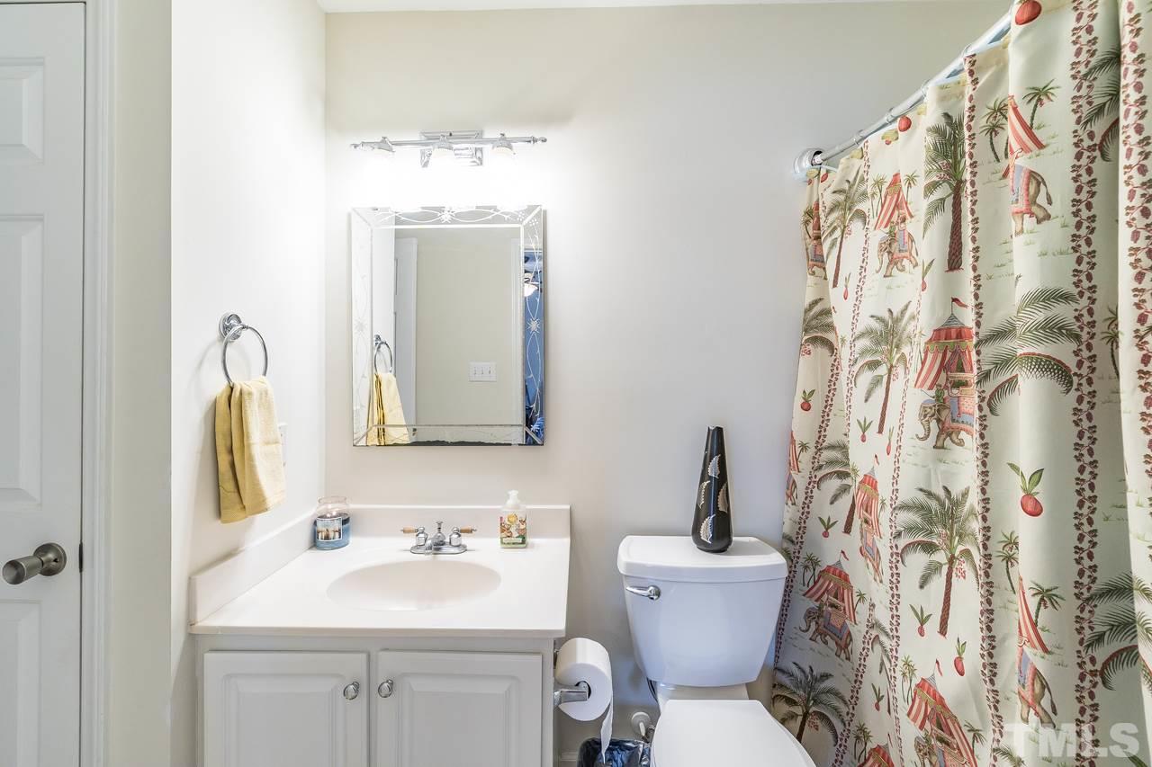 5712 Novaglen Road Durham, NC 27712 - Photo 18 of 27 Guest bathroom has a shower/tub combo.