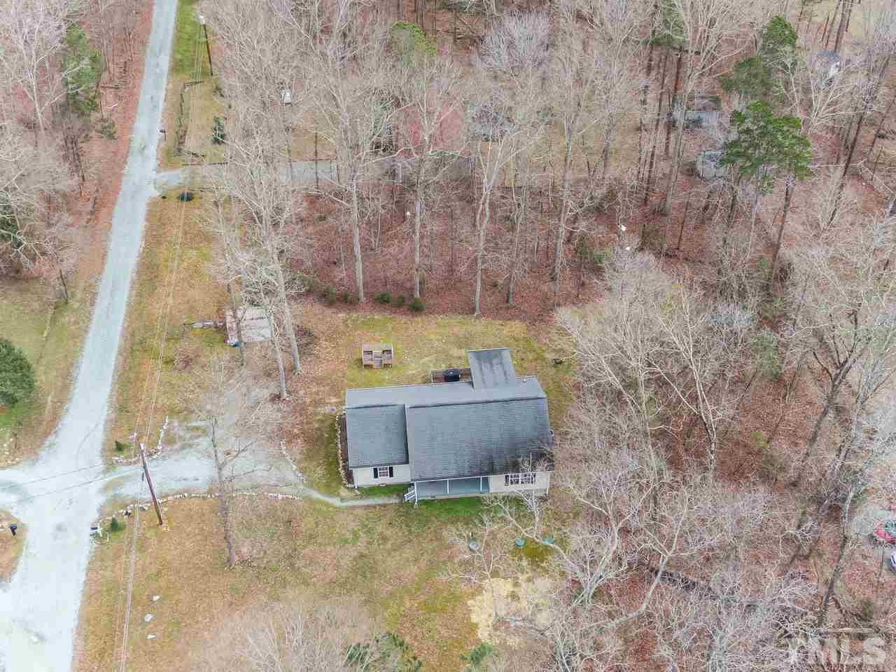 5712 Novaglen Road Durham, NC 27712 - Photo 24 of 27 Cleared yard is surrounded by trees for excellent privacy!