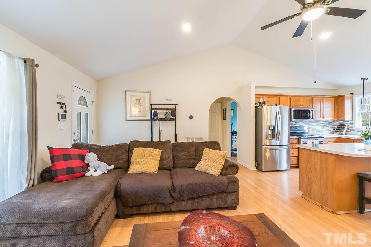 Living room connects to kitchen and dining areas!