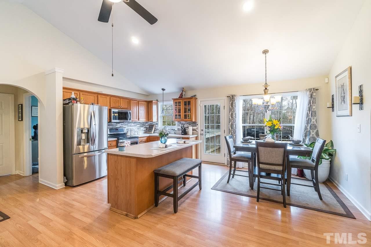Welcoming kitchen and dining area with vaulted ceiling and lots of natural light!