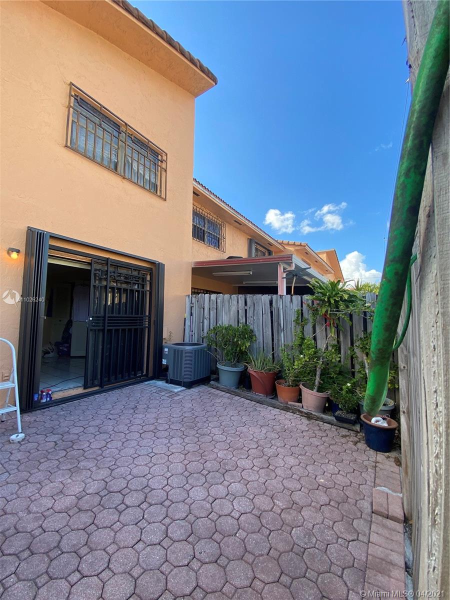 5900 West 18th Avenue, Unit A14 Hialeah, FL 33012 - Photo 2 of 29 a view of a house with a porch