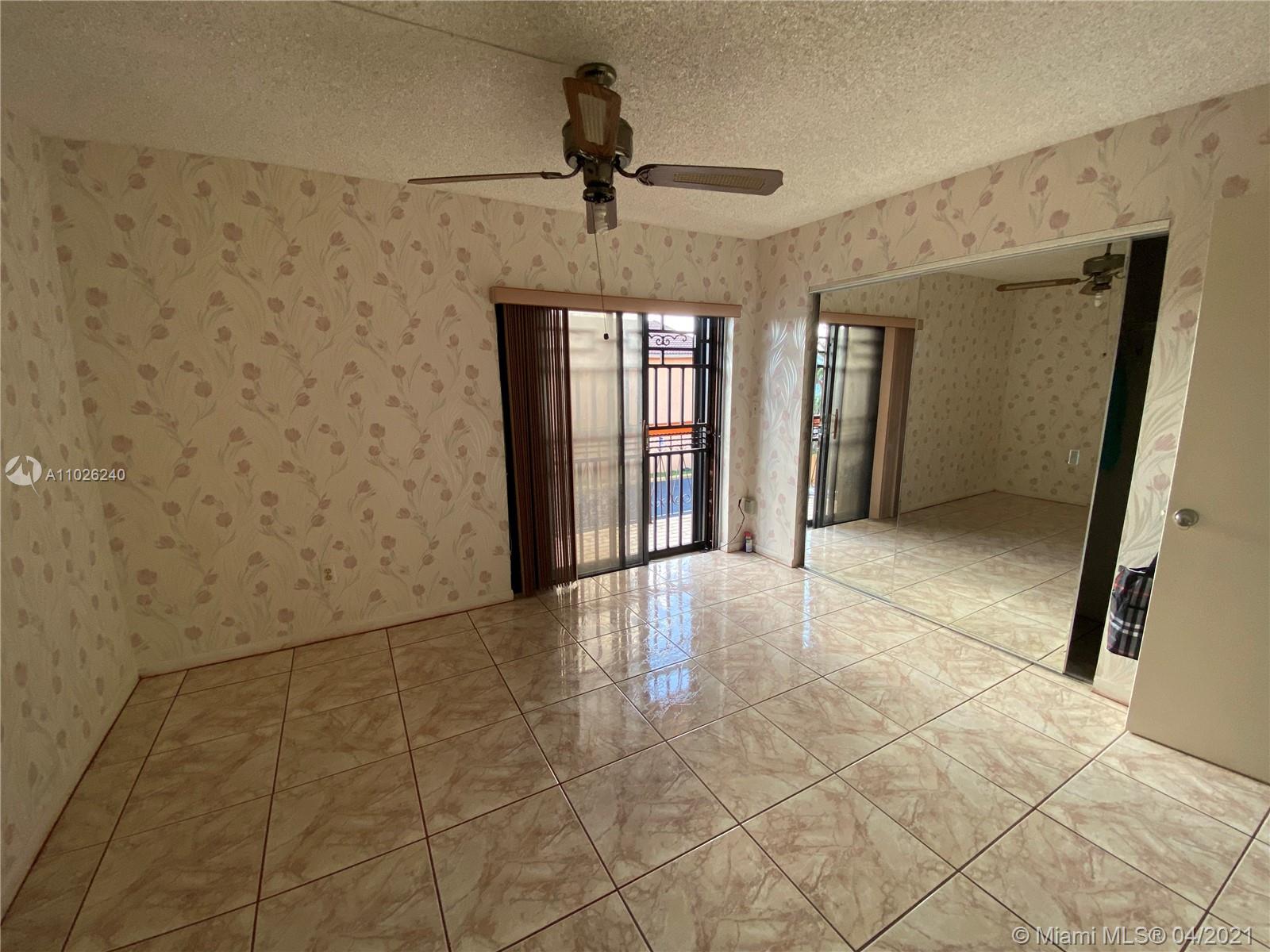 5900 West 18th Avenue, Unit A14 Hialeah, FL 33012 - Photo 21 of 29 a view of an empty room and window