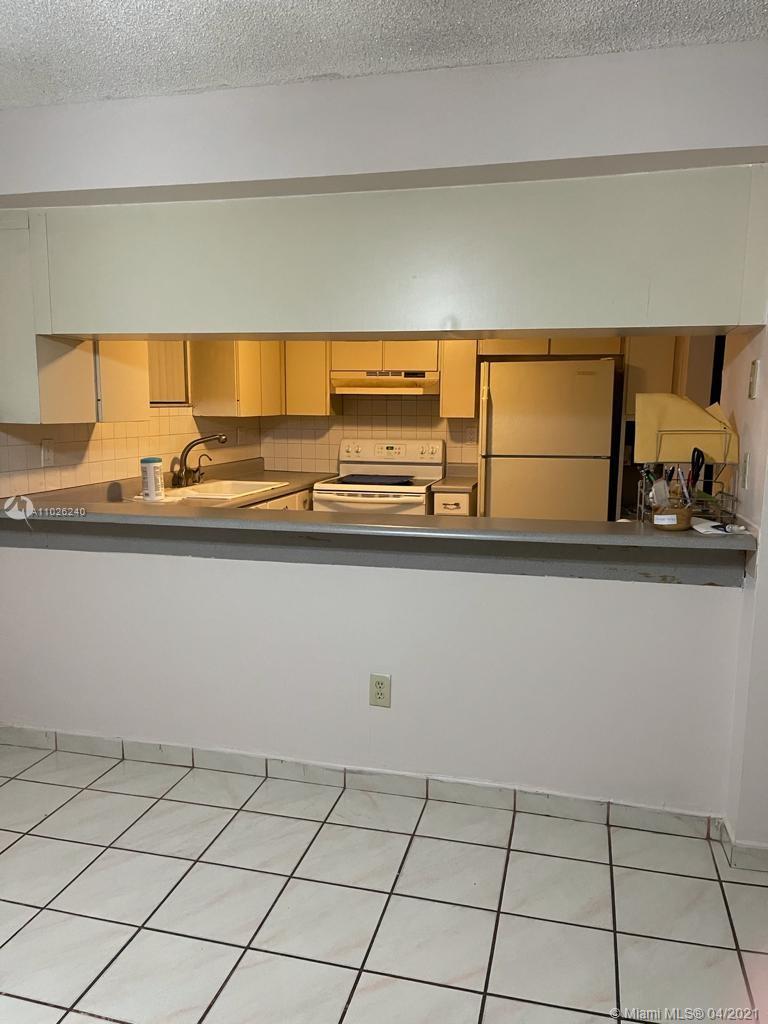 5900 West 18th Avenue, Unit A14 Hialeah, FL 33012 - Photo 8 of 29 a view of a kitchen