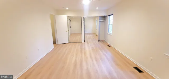 a view of wooden floor in an empty room