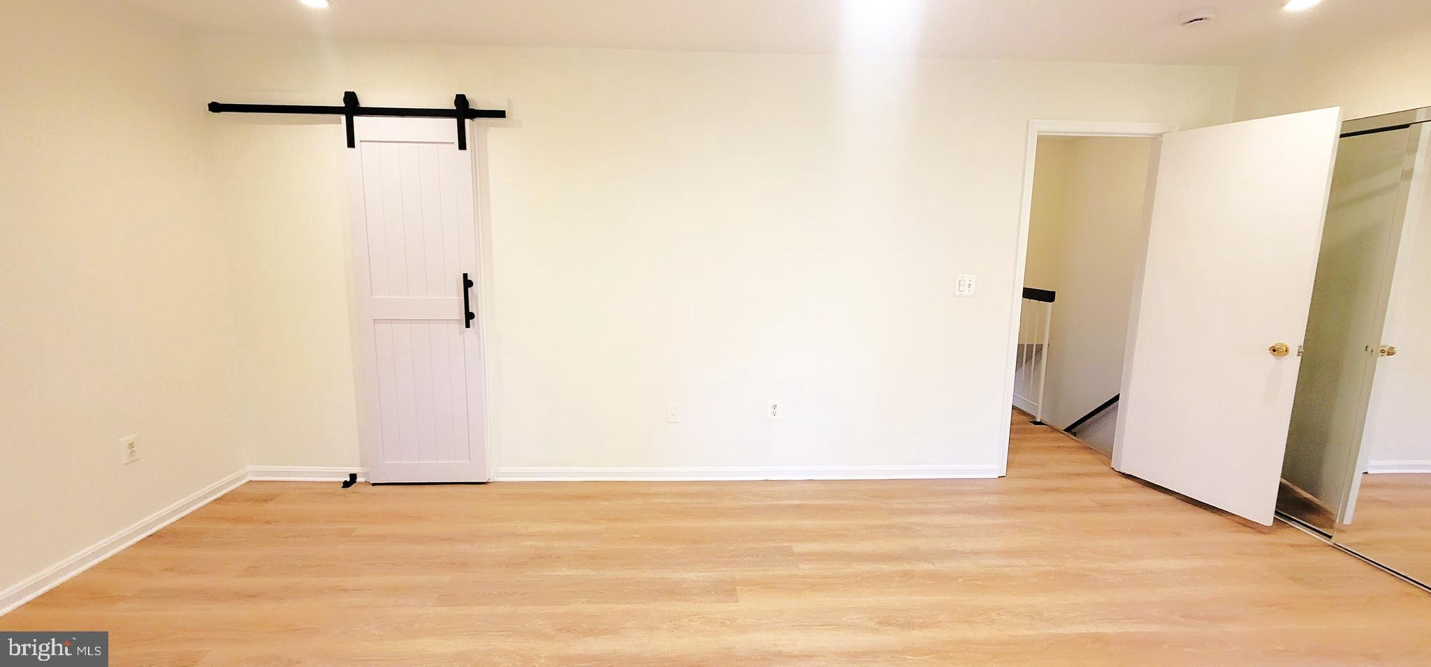 7 Plum Grove Way Gaithersburg, MD 20878 - Photo 19 of 46 a view of a room with wooden floor