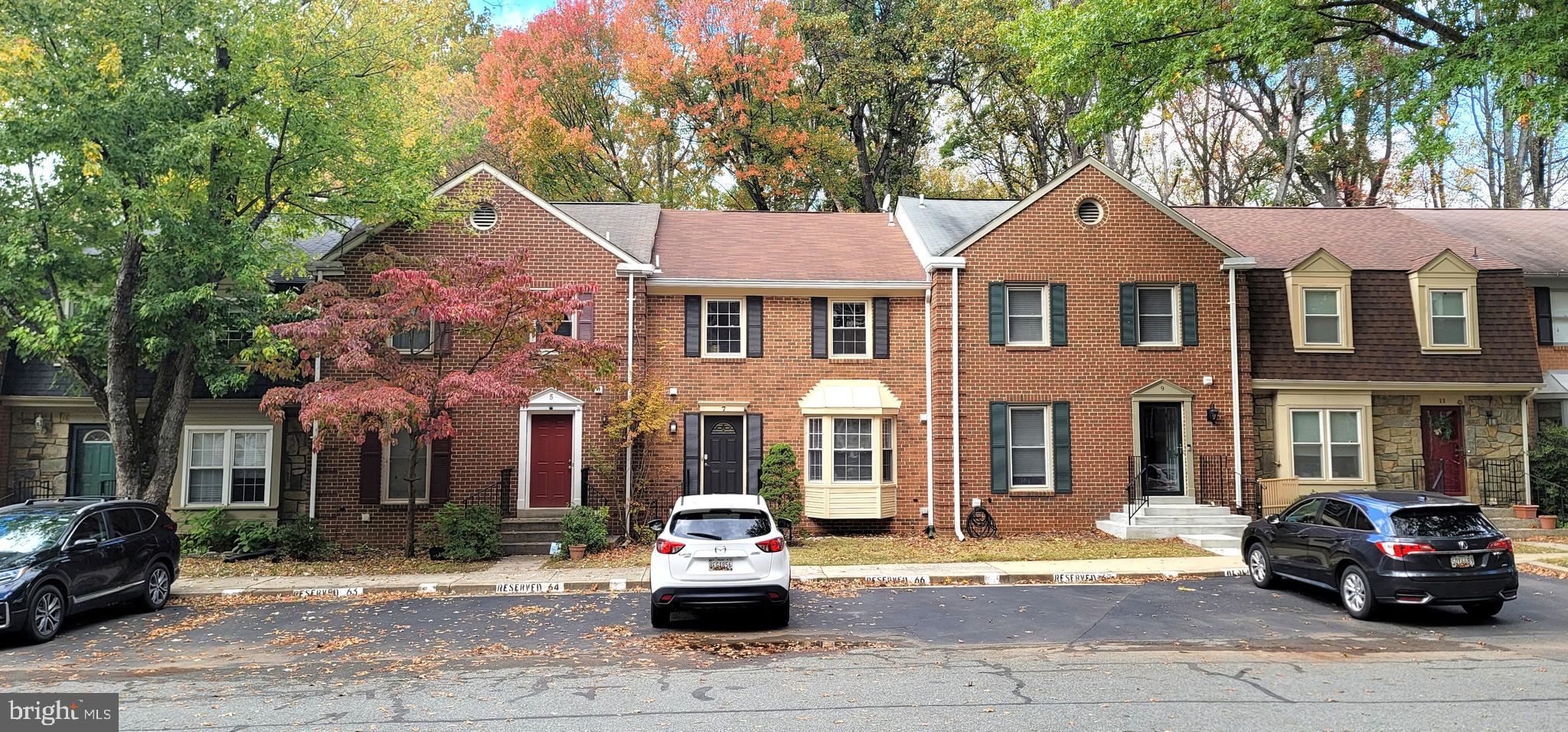 7 Plum Grove Way Gaithersburg, MD 20878 - Photo 2 of 46 a car parked in front of a brick house