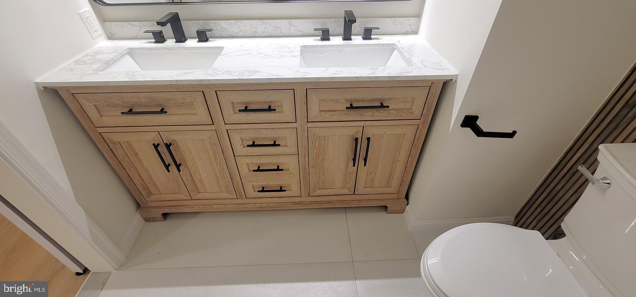 7 Plum Grove Way Gaithersburg, MD 20878 - Photo 24 of 46 a bathroom with a sink a toilet and mirror