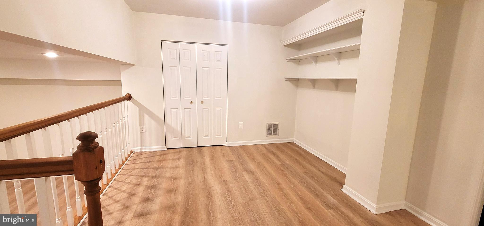 7 Plum Grove Way Gaithersburg, MD 20878 - Photo 36 of 46 a view of empty room with wooden floor and fan