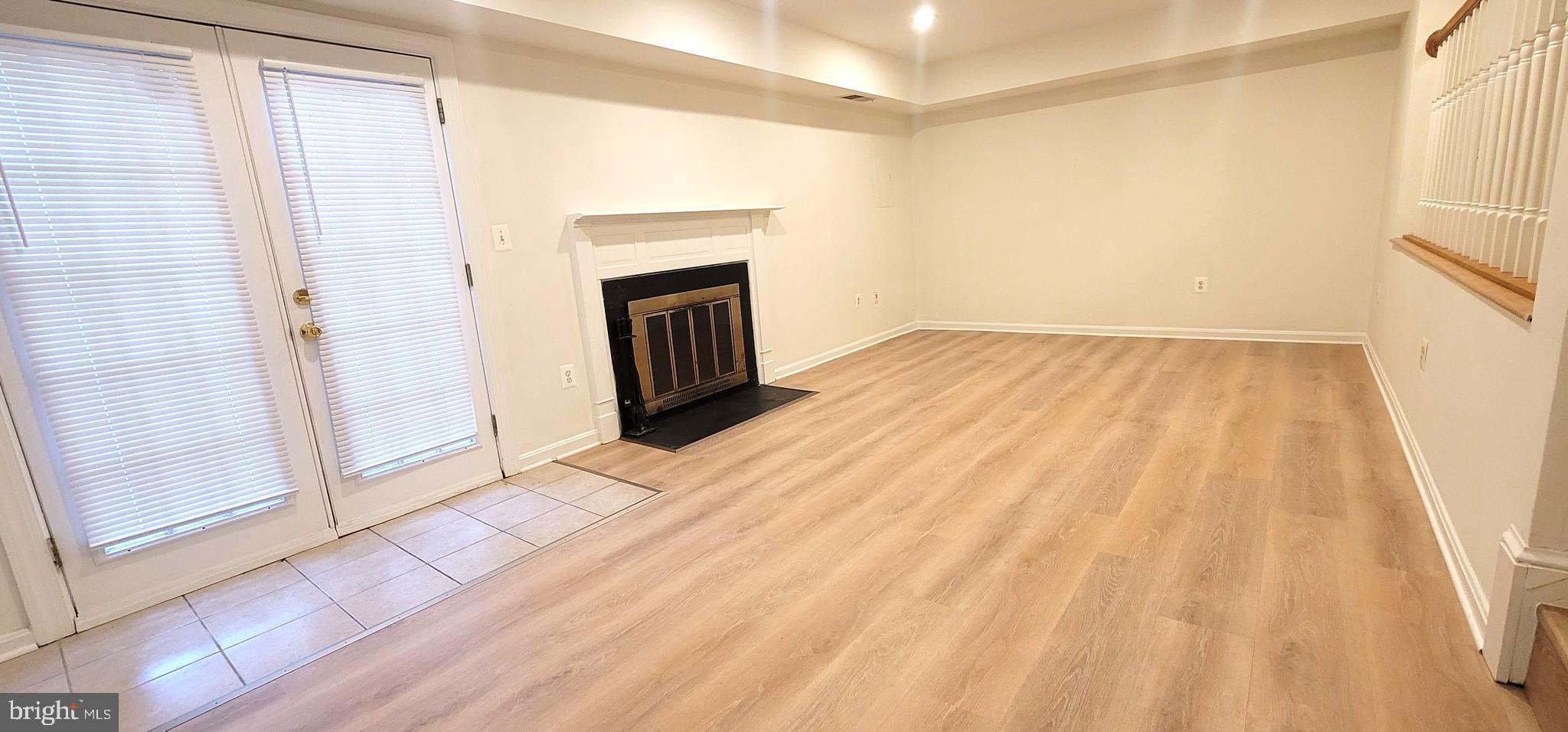 7 Plum Grove Way Gaithersburg, MD 20878 - Photo 38 of 46 a view of empty room with wooden floor and fan