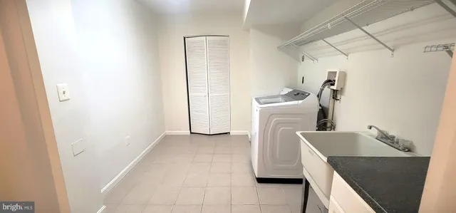 a view of a kitchen with storage and utility