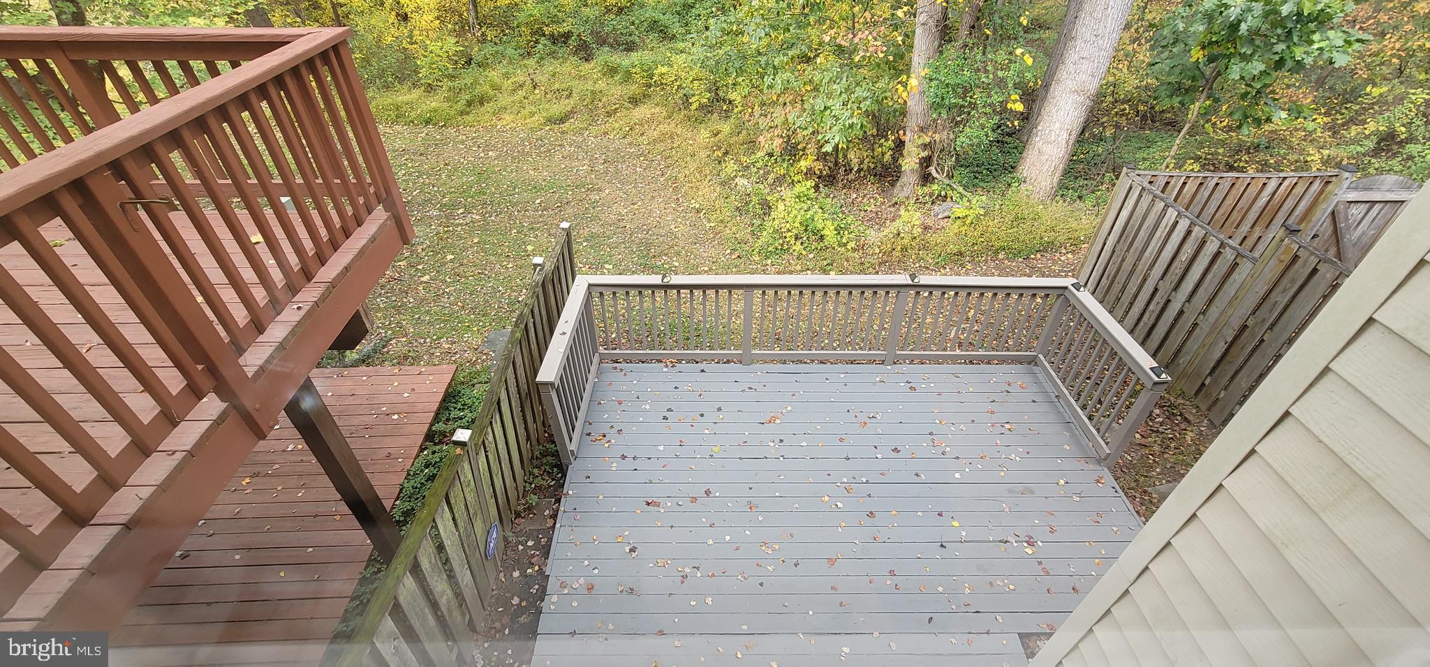 7 Plum Grove Way Gaithersburg, MD 20878 - Photo 42 of 46 a view of balcony with wooden floor and a bench