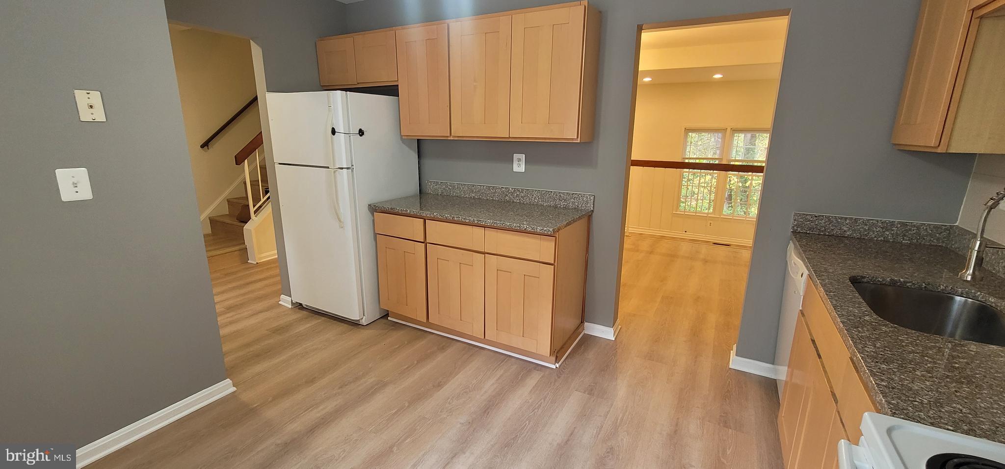 7 Plum Grove Way Gaithersburg, MD 20878 - Photo 7 of 46 a utility room with wooden floor washer and dryer