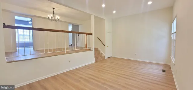 a view of an entryway with wooden floor