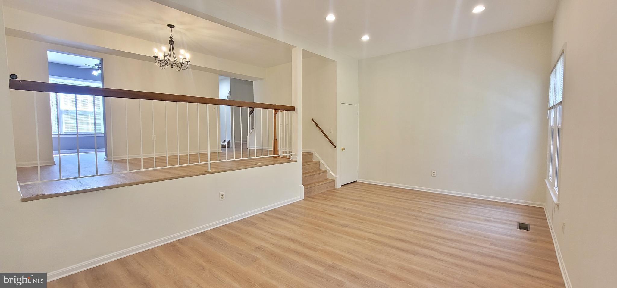 7 Plum Grove Way Gaithersburg, MD 20878 - Photo 10 of 46 a view of an entryway with wooden floor
