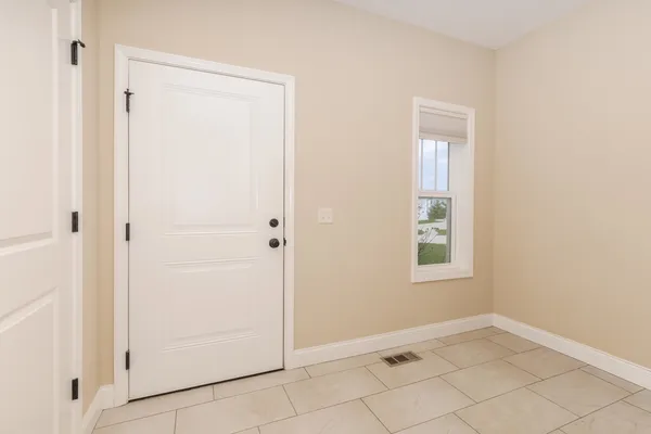 a view of an empty room with a window