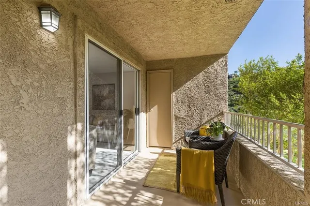 a balcony view with chairs