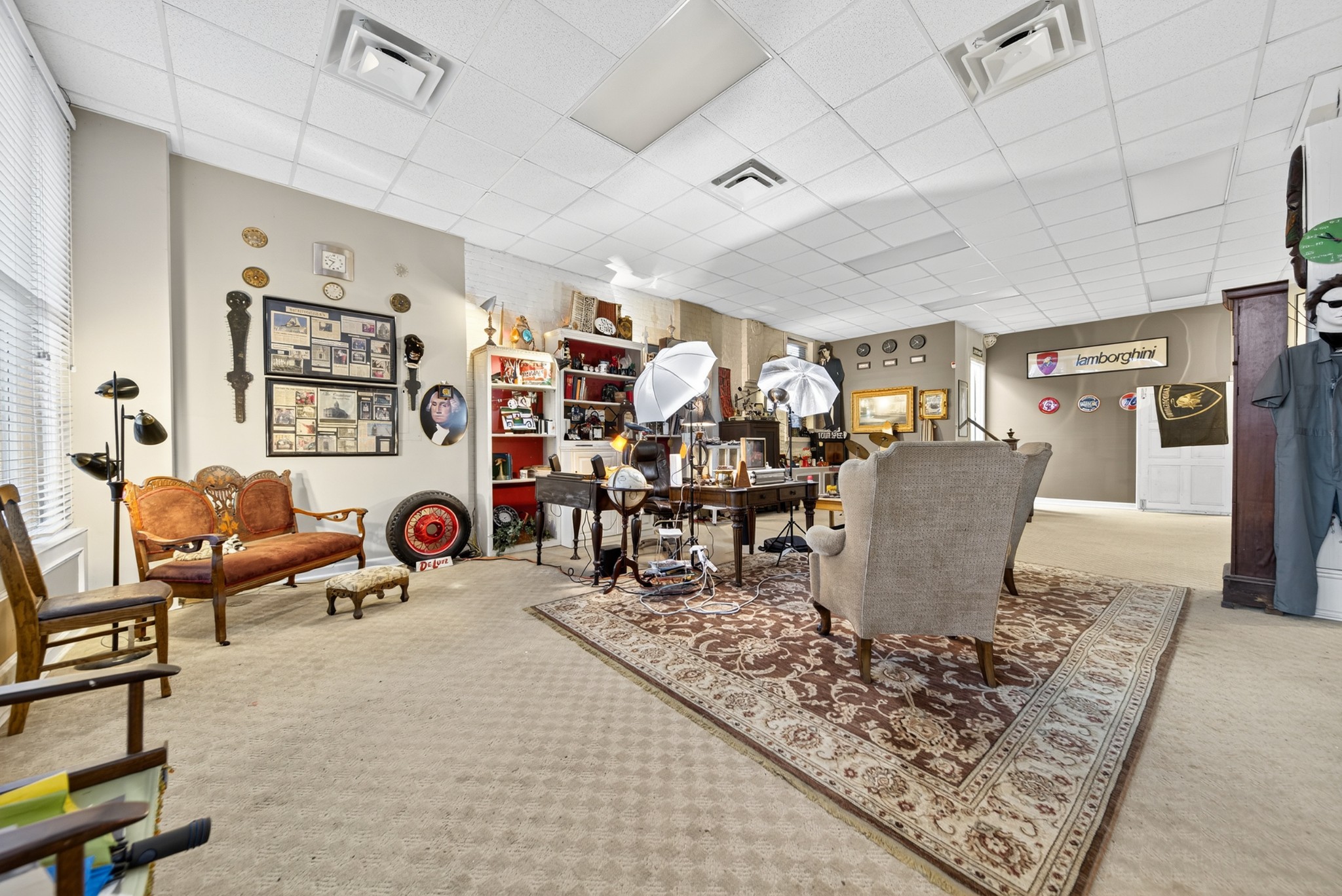 109 East 7th Avenue Springfield, TN 37172 - Photo 85 of 99 a living room with lots of furniture and paintings on the wall
