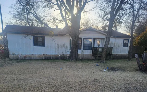 a house with a tree in front of it