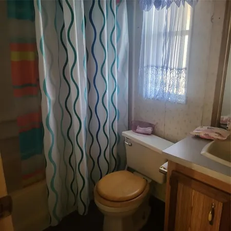 a bathroom with a toilet and a sink