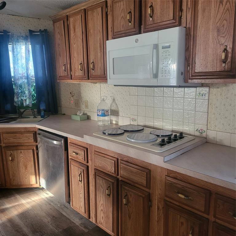 548 Highway 69 Point, TX 75472 - Photo 19 of 22 a kitchen with stainless steel appliances granite countertop a sink a stove and cabinets