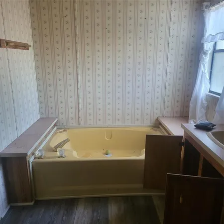 a room with a bed and a window