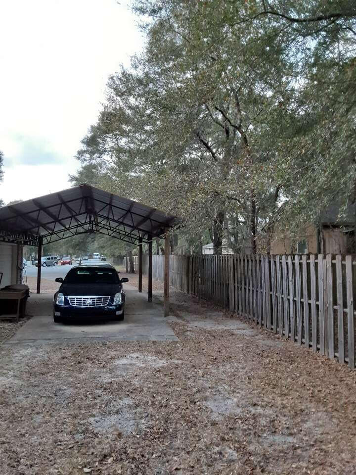 100 Cedar Place Freeport, FL 32439 - Photo 2 of 9 a car parked in front of a house