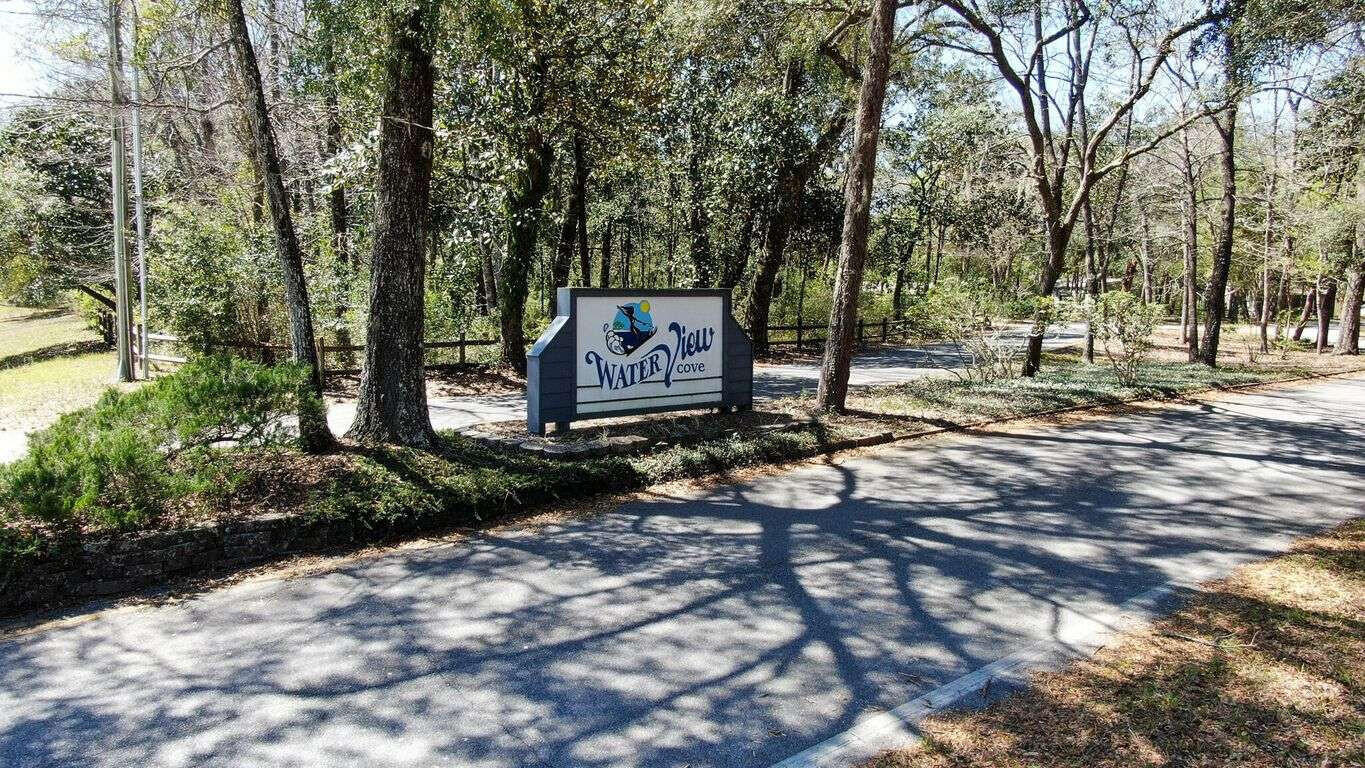 100 Cedar Place Freeport, FL 32439 - Photo 4 of 9 a sign board with a park benches