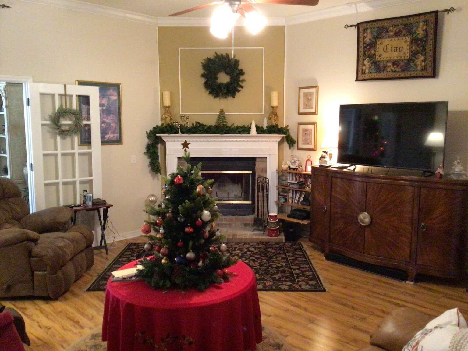 100 Cedar Place Freeport, FL 32439 - Photo 6 of 9 a living room with furniture a flat screen tv and a fireplace