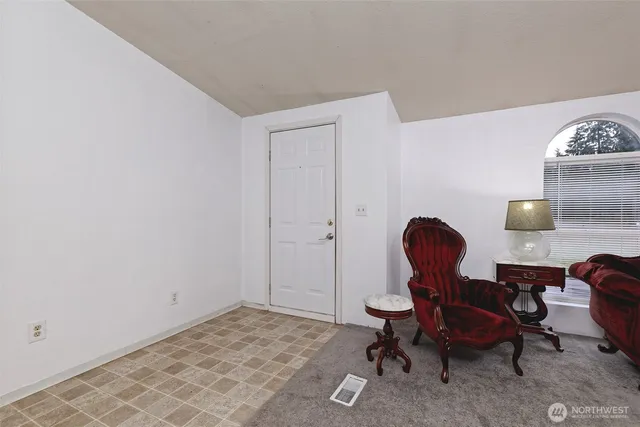 a view of a workspace room with furniture and wooden floor