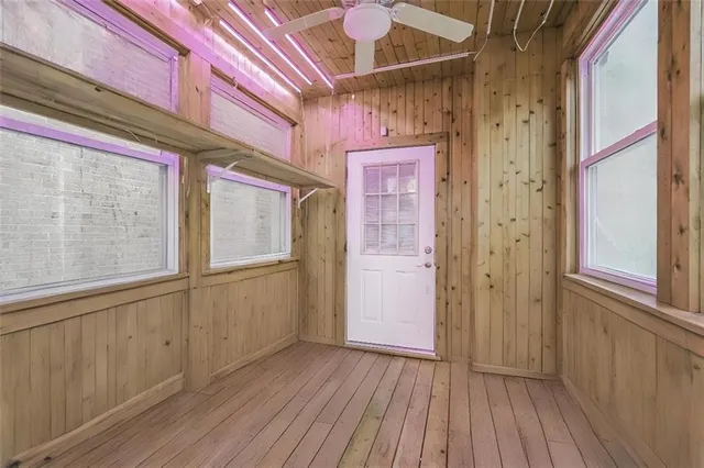 a view of front door with wooden floor