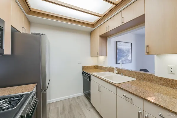 a utility room with a sink dryer and washer