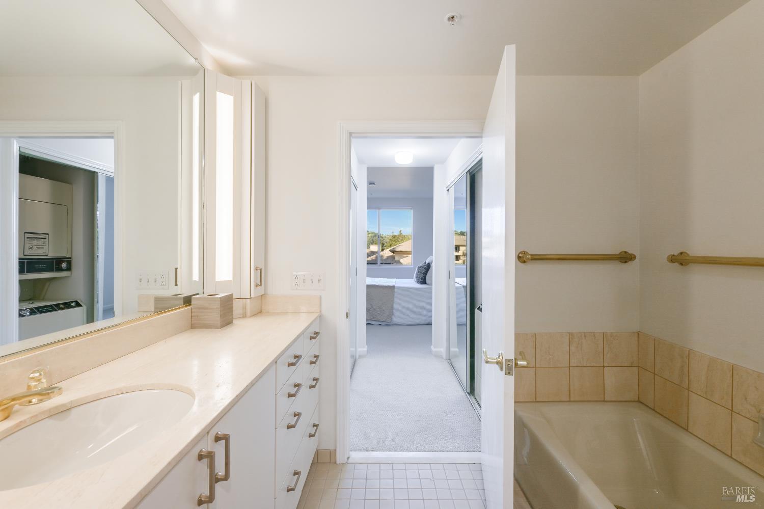 400 Deer Valley Road, Unit 3D San Rafael, CA 94903 - Photo 8 of 18 a spacious bathroom with a bathtub sink and mirror
