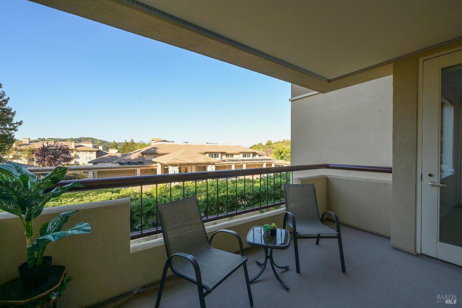 400 Deer Valley Road, Unit 3D San Rafael, CA 94903 - Photo 10 of 18 a view of a chairs and table in a balcony