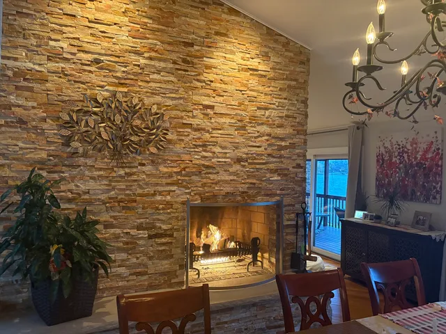 a view of a patio with dining table and chairs