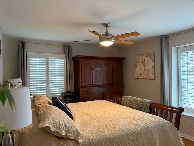 a bedroom with a large bed and a window