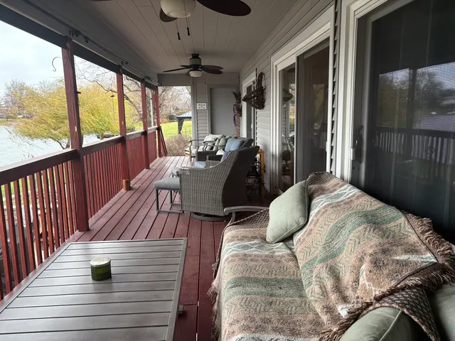 a view of balcony with couch and wooden floor