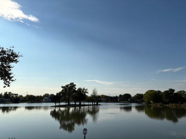 a view of a lake with houses in background
