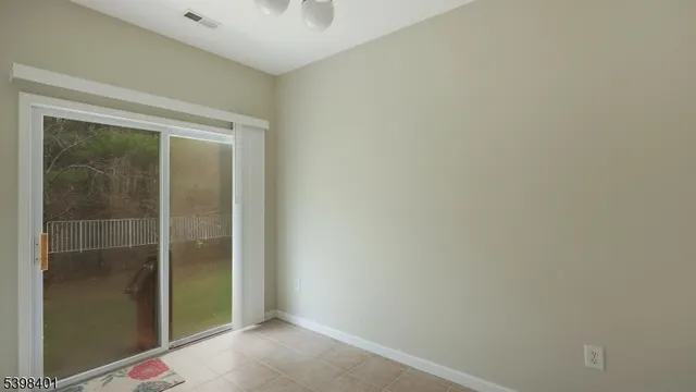 an empty room with mirror