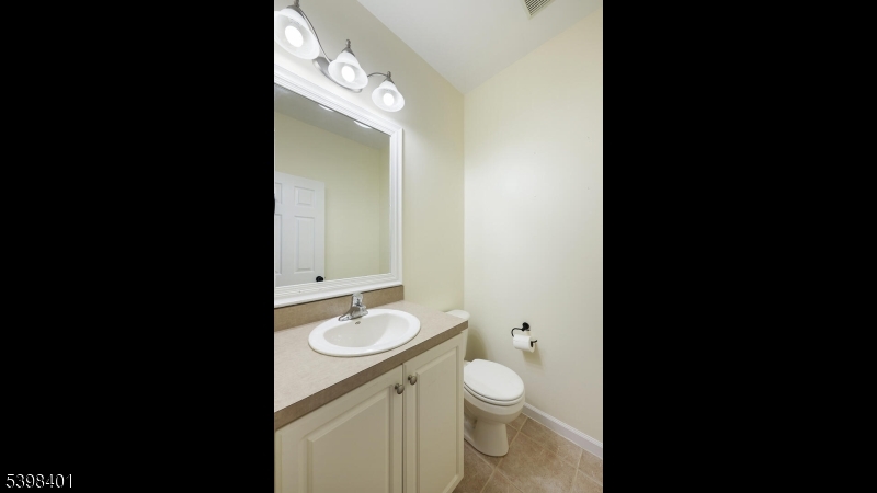 18 Truman Avenue Princeton, NJ 08540 - Photo 17 of 29 a bathroom with a toilet a sink and mirror