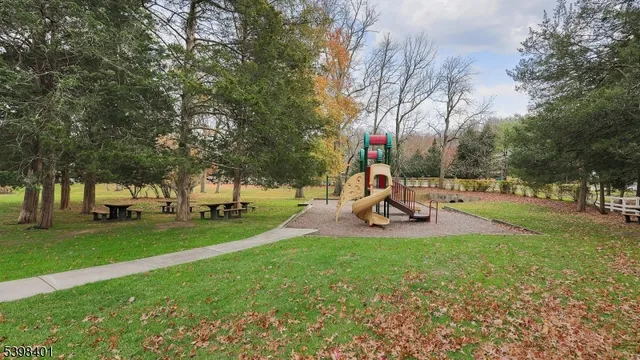 a view of a park with swings and a slide