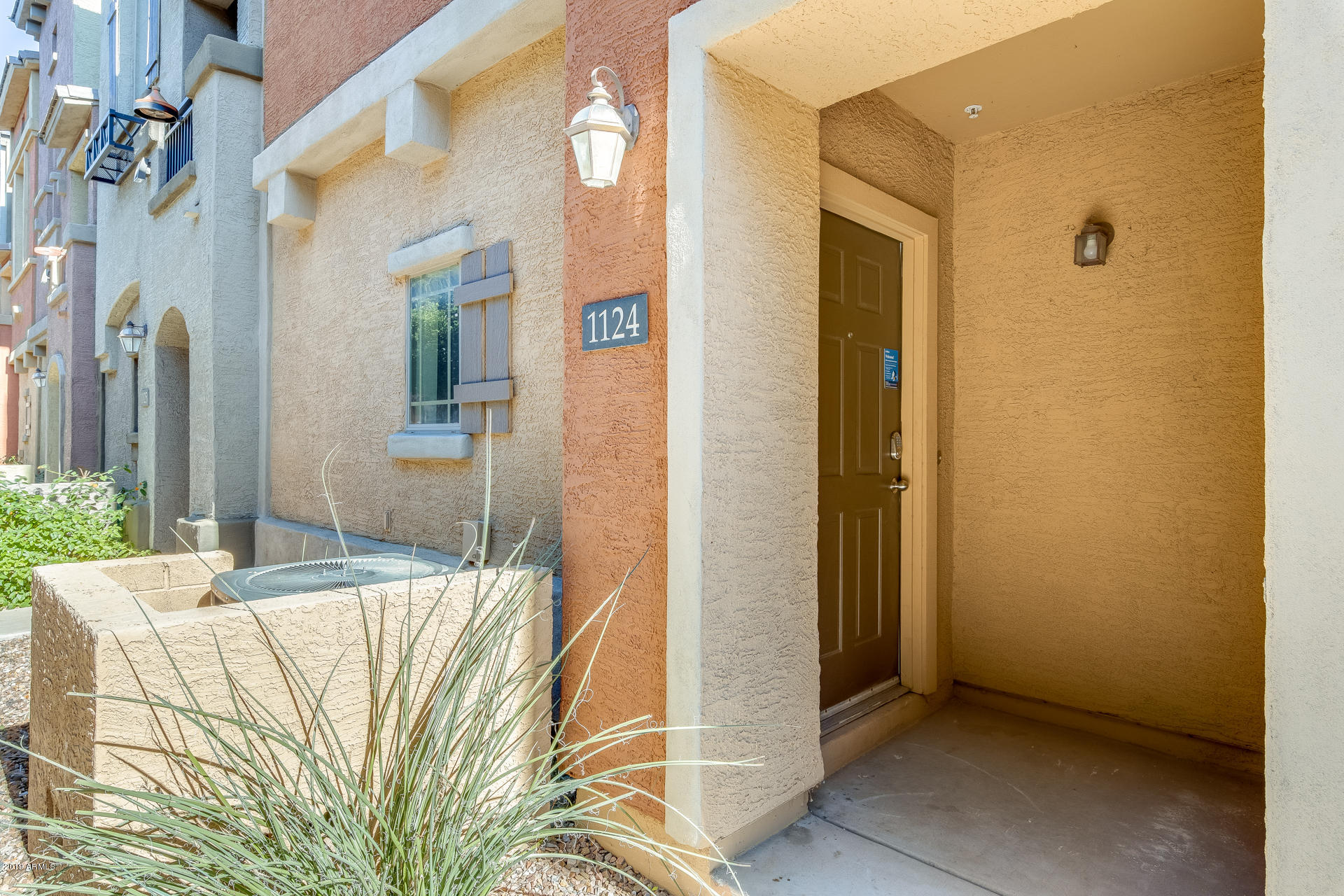 2401 East Rio Salado Parkway, Unit 1124 Tempe, AZ 85288 - Photo 8 of 32 a bedroom with a bed and a mirror